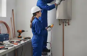 Tucson, AZ plumber installing a tankless water heater for an emergency plumbing repair service